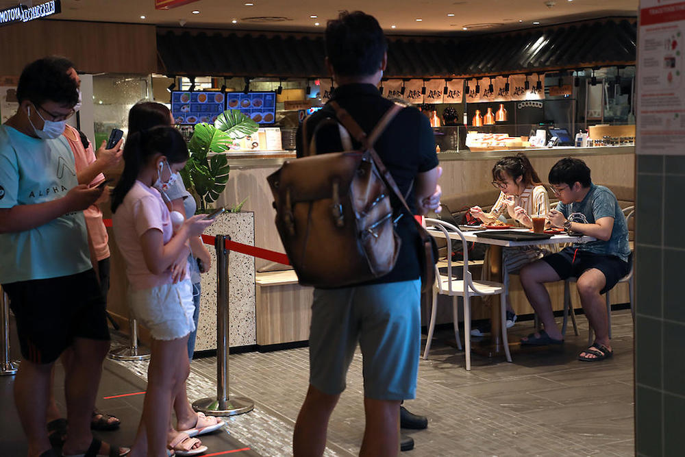 Diners at a restaurant in Ion Orchard mall in August 2021. u00e2u20acu201d TODAY picnn