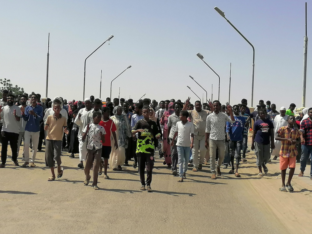 Sudanese demonstrators march and chant during a protest against the military takeover, in Atbara, Sudan October 27, 2021 in this social media image. u00e2u20acu2022 Reuters picnnn