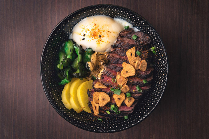 The wagyu 'don' is beefed up with pickles, fried garlic chips and an 'onsen' egg.