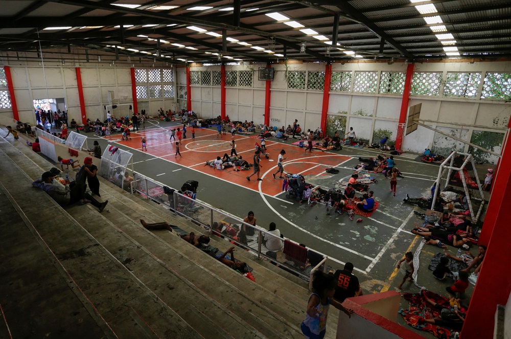 Migrants rest in a sports court as they take part in a caravan heading to Mexico City, in Villa Comaltitlan, Mexico October 27, 2021. u00e2u20acu2022 Reuters pic