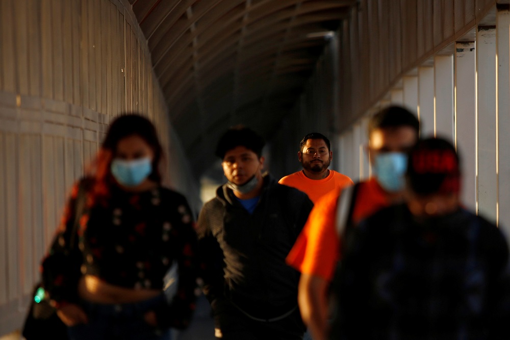 People walk towards the US at the Paso del Norte International Border bridge in Ciudad Juarez, Mexico October 13, 2021. u00e2u20acu2022 Reuters pic