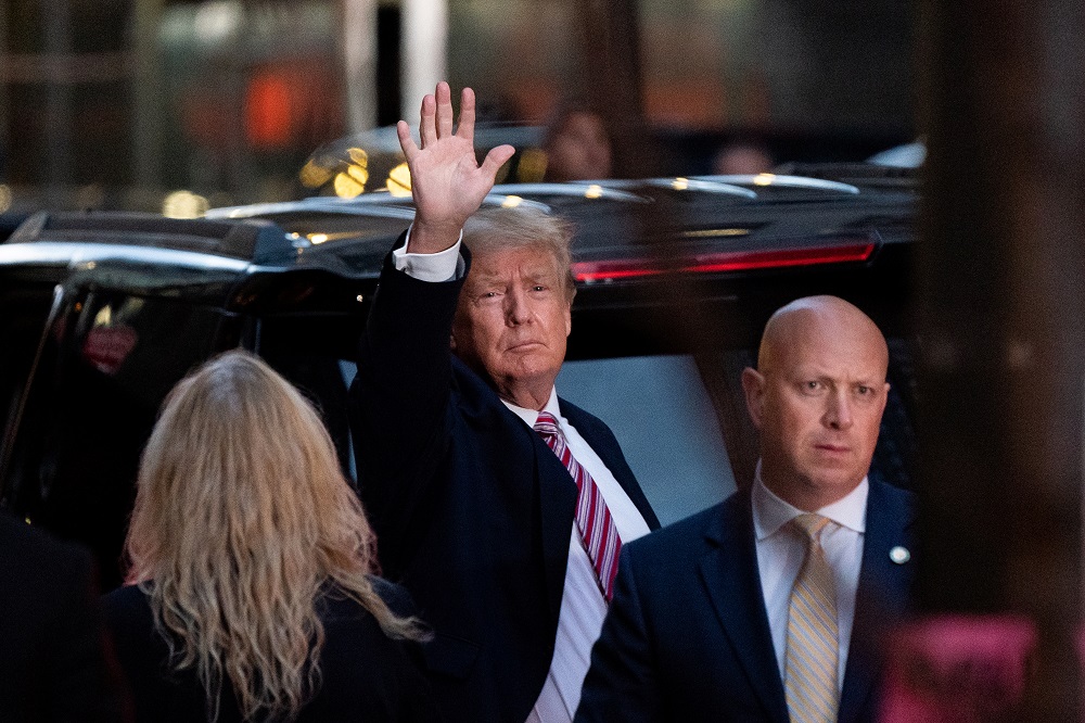 Former US President Donald Trump acknowledges people as he gets in his SUV outside Trump Tower in New York October 18, 2021. u00e2u20acu2022 Reuters pic