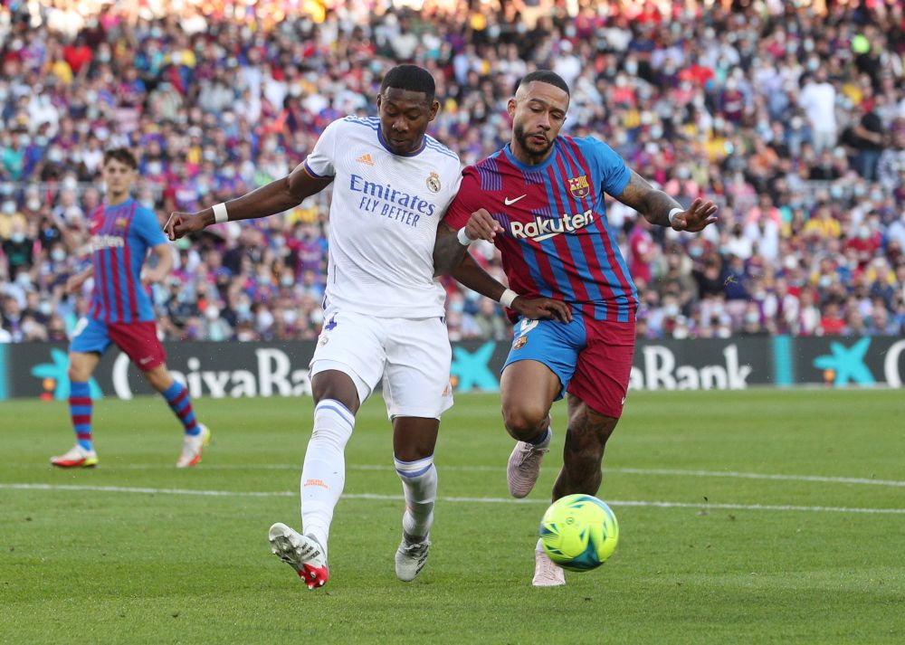 FC Barcelona's Memphis Depay in action with Real Madrid's David Alaba at Camp Nou October 24, 2021. u00e2u20acu201d Reuters pic