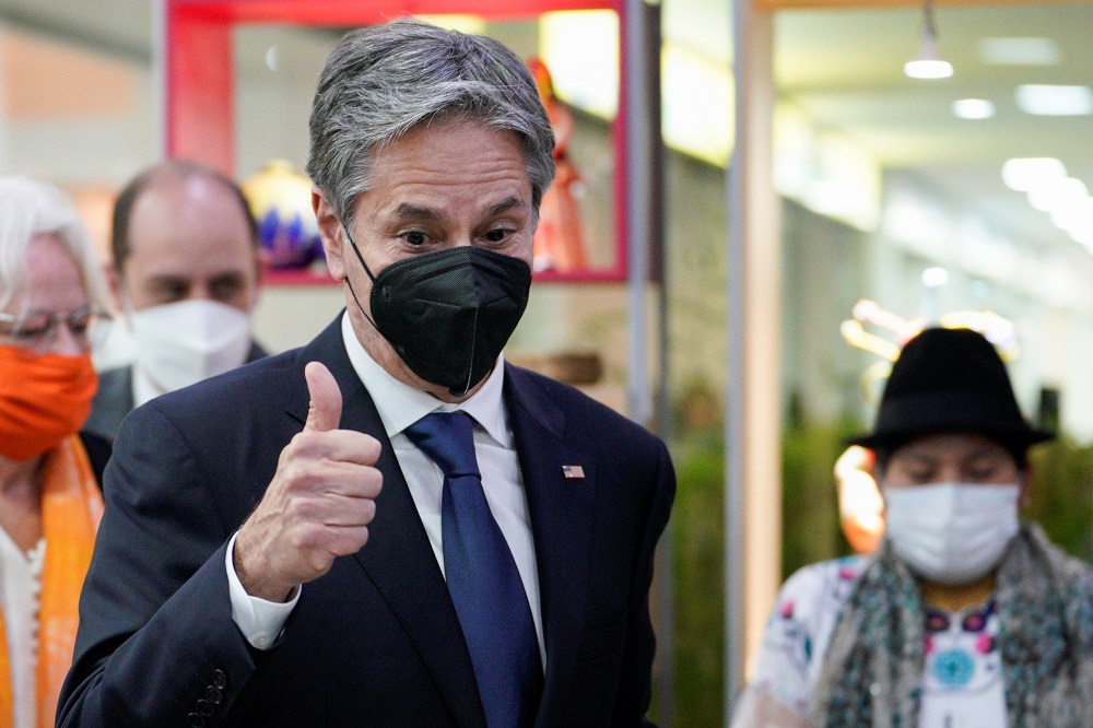 US Secretary of State Antony Blinken gestures as he visits the Camari market centre, where artisans and farmers showcase their products, in Quito, Ecuador October 19, 2021. u00e2u20acu2022 Santiago Arcos/Pool via Reuters
