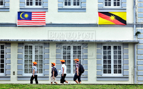 Children walk past the Sarawak Museum during an educational visit to Kuching City. u00e2u20acu201d File pic by Muhammad Rais Sanusi via Borneo Post