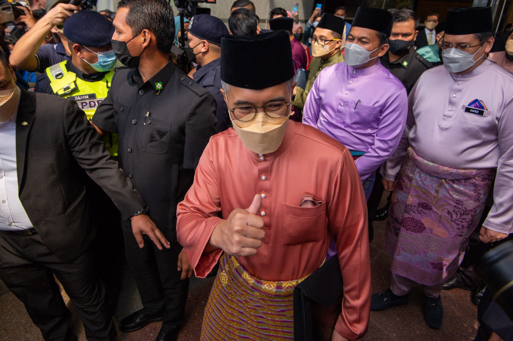Finance Minister Datuk Seri Tengku Zafrul Abdul Aziz with the Budget 2022 report at the Finance Ministry, October 29, 2021. u00e2u20acu201d Picture by Shafwan Zaidon
