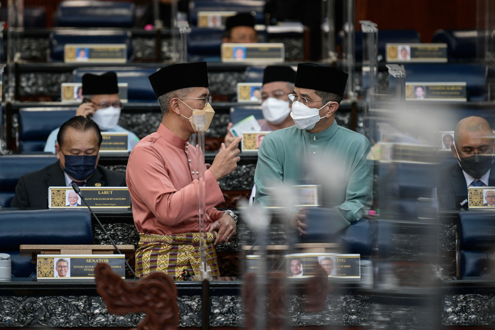 Finance Minister Datuk Seri Tengku Zafrul Abdul Aziz with Senior Minister of International Trade and Industry Datuk Seri Mohamed Azmin Ali before the 2022 Budget presentation at Parliament, October 29, 2021. u00e2u20acu201d Bernama pic 
