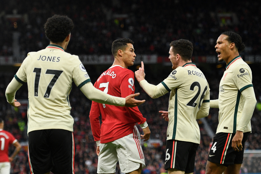 Liverpoolu00e2u20acu2122s Andrew Robertson and Virgil van Dijk confront Manchester Unitedu00e2u20acu2122s Cristiano Ronaldo after he scuffled with Curtis Jones during the English Premier League match at Old Trafford in Manchester, October 24, 2021. u00e2u20acu201d AFP pic 