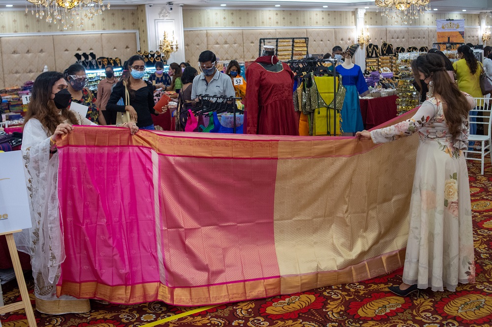 Some people consider it wise and safe to attend indoor Deepavali carnivals as long as the SOP is followed. ― Picture by Shafwan Zaidon