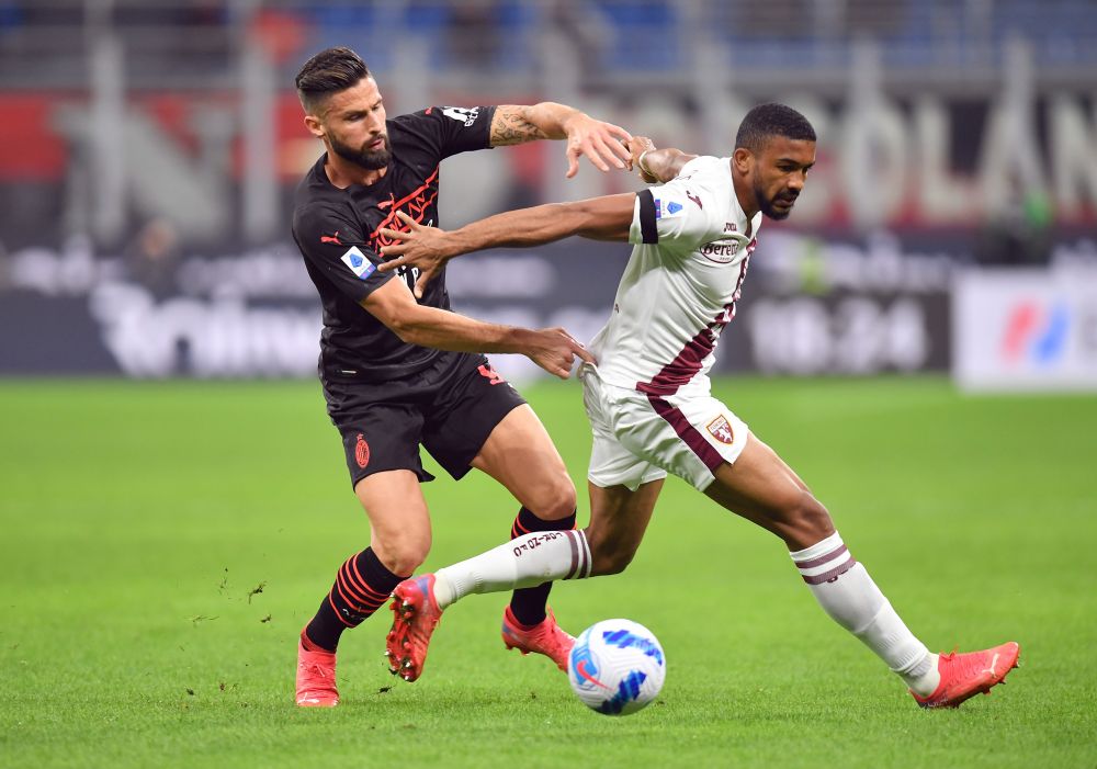 Torino's Koffi Djidji in action with AC Milan's Olivier Giroud at the San Siro, Milan October 26, 2021. u00e2u20acu201d Reuters pic