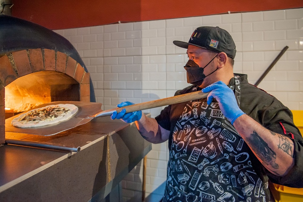 Pizza being prepared for customers. ― Picture courtesy of Grab
