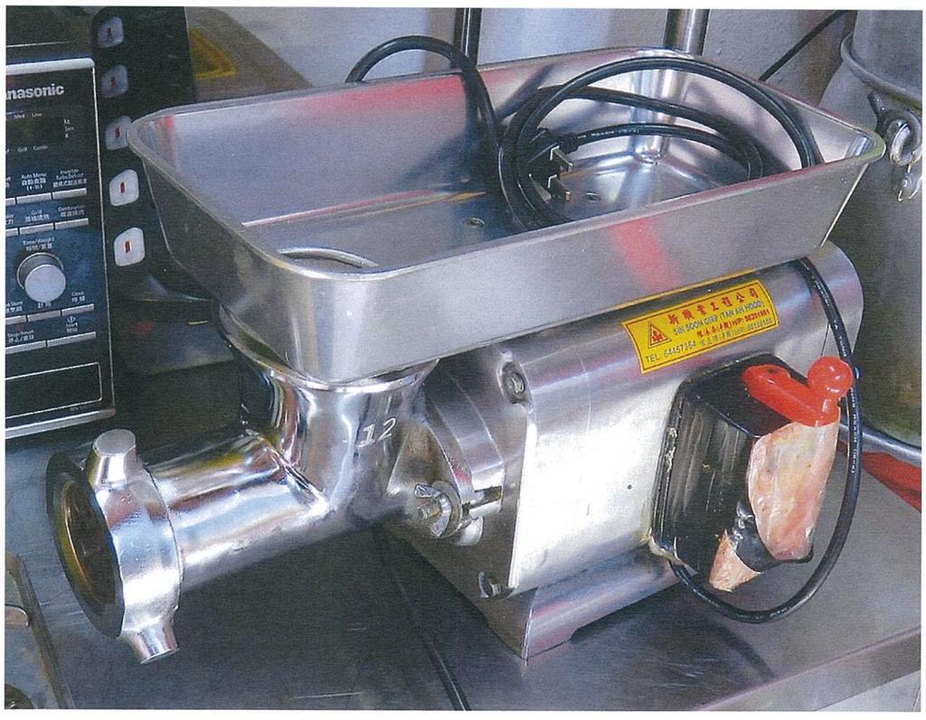 The electric meat grinder which maid Su Su Mar put her fingers into without switching it off, thereby severing four of her fingers. u00e2u20acu201d Singapore court document via TODAY