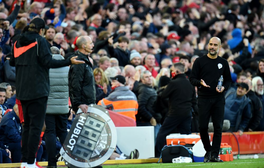 Liverpool manager Jurgen Klopp and Manchester City manager Pep Guardiola react during the game at Anfield, Liverpool October 3, 2021. u00e2u20acu201d Reuters picnnn