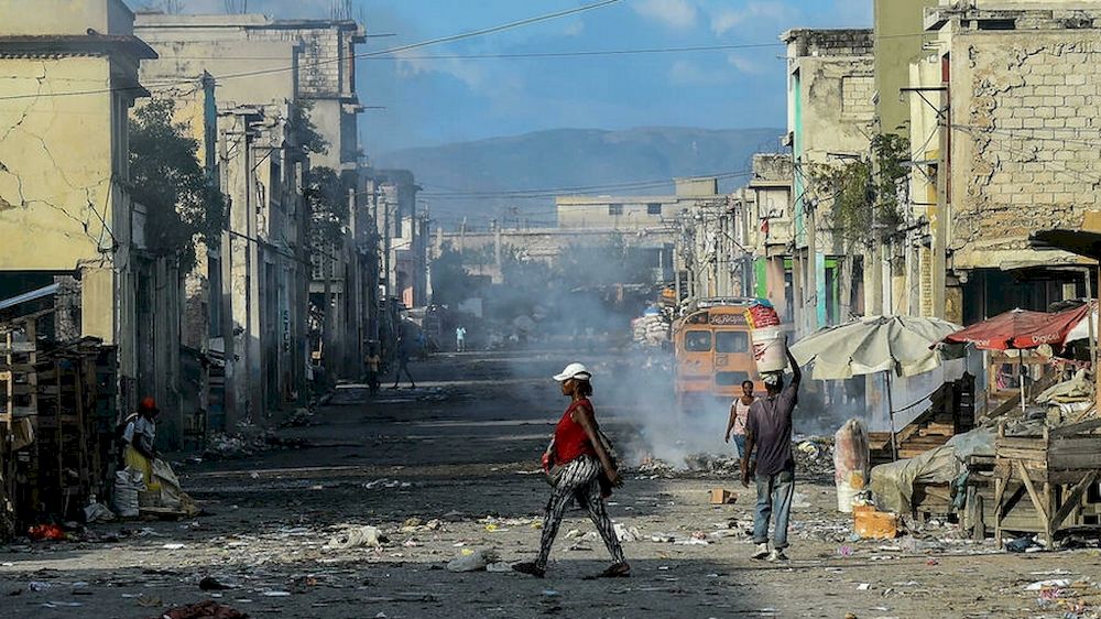 Haitians walk on a deserted street in Port-au-Prince, December 20 2019. u00e2u20acu201d AFP pic