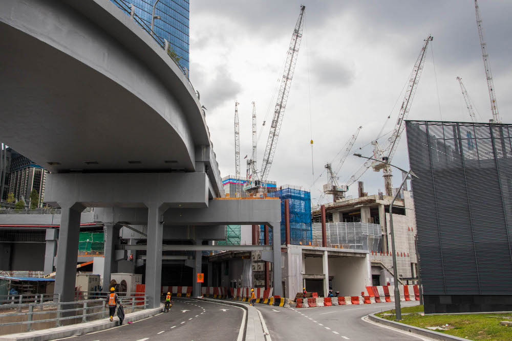 Cranes and material stand at a construction site near the Tun Razak Exchange (TRX) financial district in Kuala Lumpur, October 28, 2021. u00e2u20acu201d Picture by Firdaus Latif