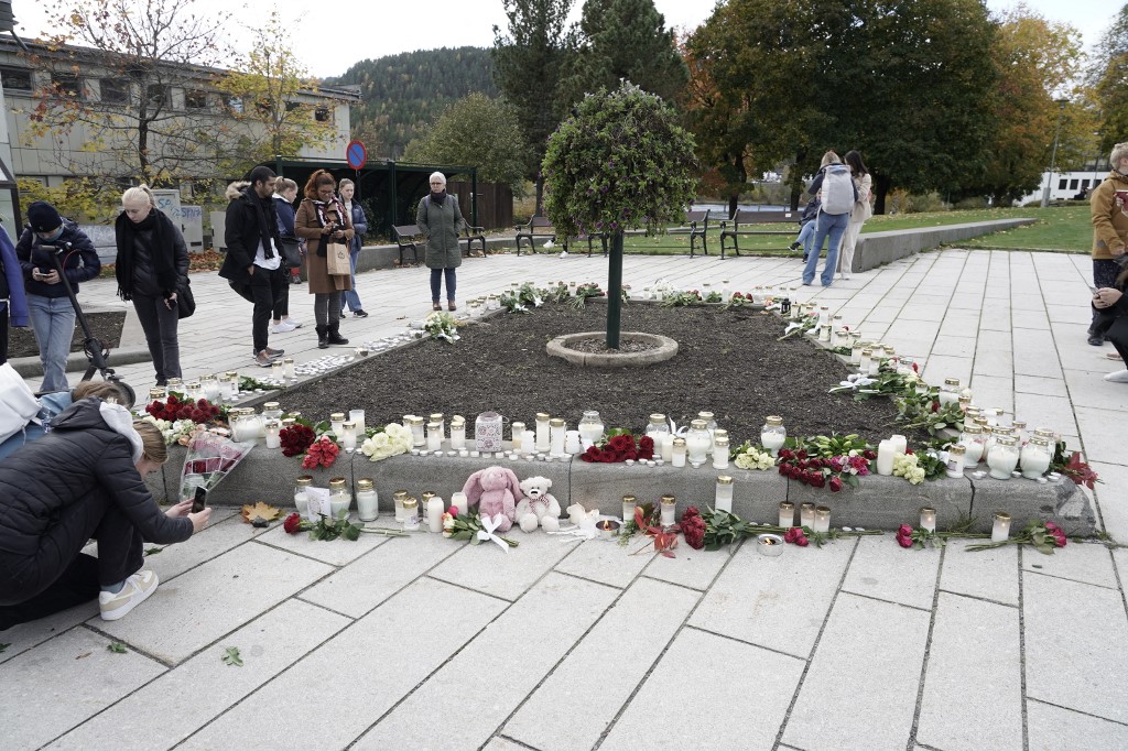 Inhabitants set up flowers and candles in the centre of Kongsberg, Norway, on October 14, 2021, the day after a man armed with a bow and arrows killed five people before being arrested by police. u00e2u20acu201d AFP pic