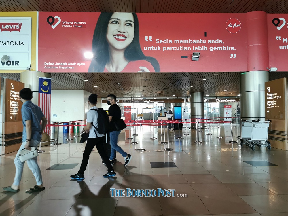 Travellers are seen at Kuching International Airport. u00e2u20acu201d Picture by Roystein Emmor via Borneo Post Online