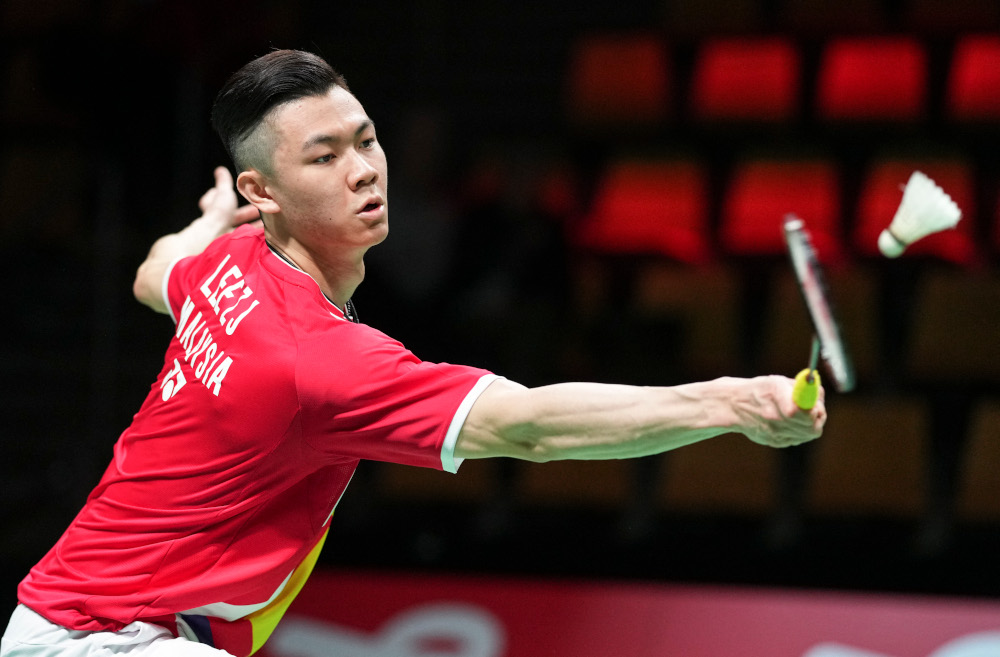 Malaysiau00e2u20acu2122s Jia Lee Zii competes with Japanu00e2u20acu2122s Kento Momota (unseen) during a menu00e2u20acu2122s single match in the Thomas Cup menu00e2u20acu2122s team Badminton match between Japan and Malaysia in in Aarhus, Denmark, October 14, 2021. u00e2u20acu201d AFP pic 