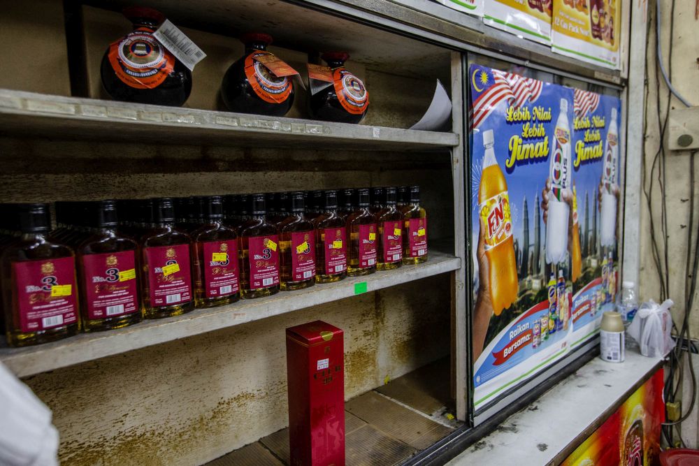 Beverages containing alcohol are placed in a separate shelf away from other regular drinks at Kedai Runcit, Ubat dan Arak Yee Hong in Sentul. u00e2u20acu201d Picture by Firdaus Latif