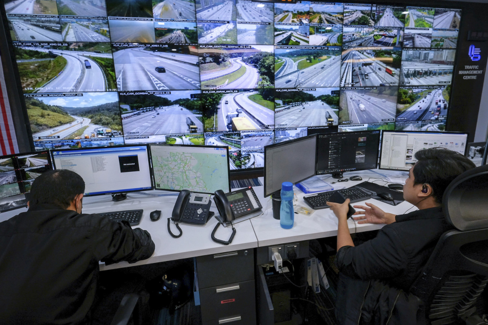 Traffic management centre staff monitors the smooth flow of traffic on 30 highways on the first day of interstate travel at the Malaysian Highway Authority Traffic Management Centre in Putrajaya, October 11, 2021. u00e2u20acu201d Bernama pic 