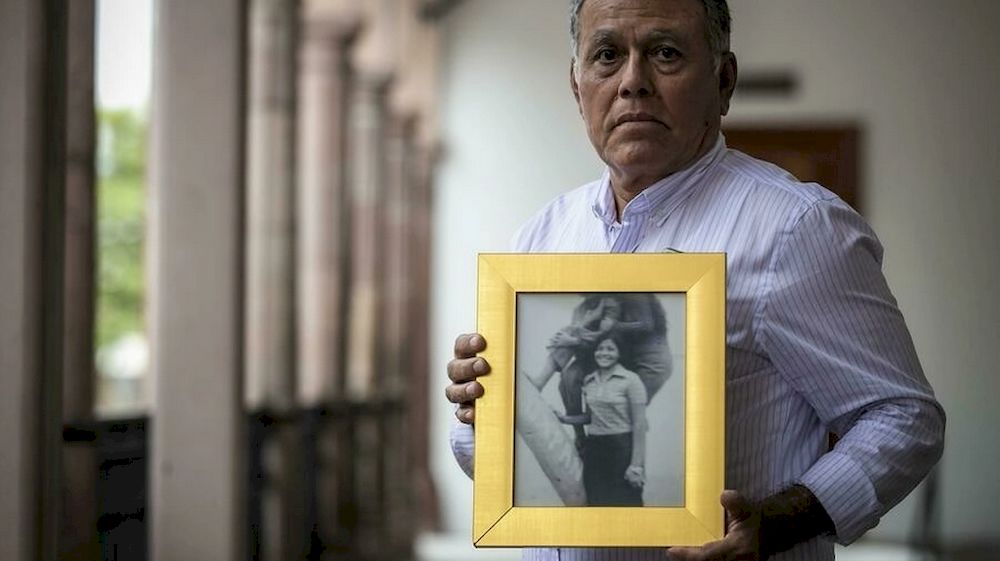 Roberto Martinez shows a picture of his sister Lourdes, who disappeared aged 23 in 1974 in Culiacan in northwest Mexico. u00e2u20acu201d AFP pic