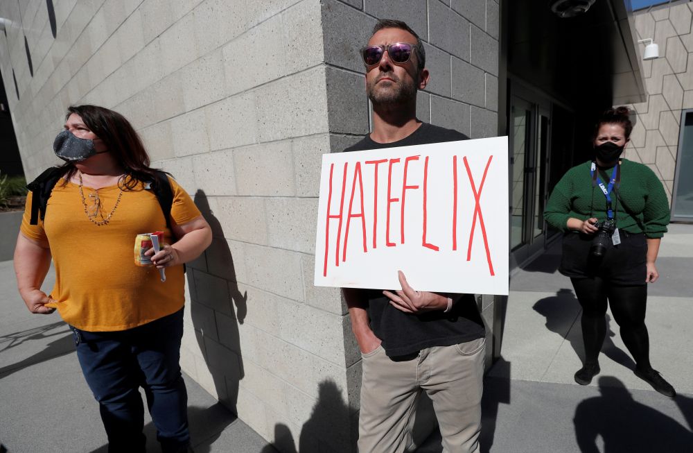 A man holds a placard as he attends a rally in support of the Netflix transgender employee walkout to protest the streaming of comedian Dave Chappelleu00e2u20acu2122s new comedy special in Los Angeles October 20, 2021. u00e2u20acu201d Reuters pic