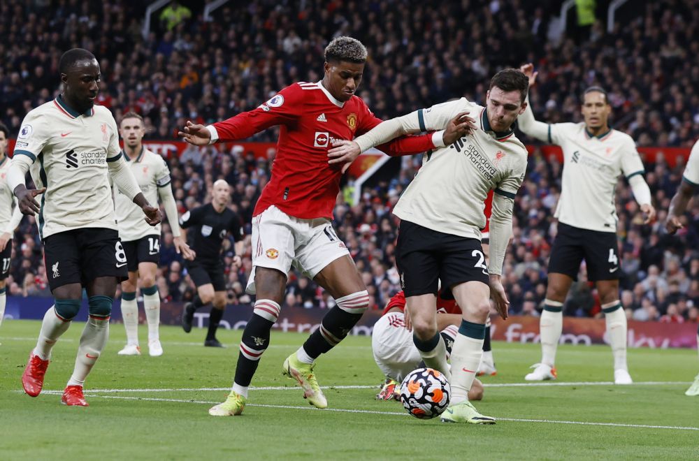 Manchester Unitedu00e2u20acu2122s Marcus Rashford in action with Liverpoolu00e2u20acu2122s Andrew Robertson at Old Trafford October 24, 2021. u00e2u20acu2022 Reuters picnn