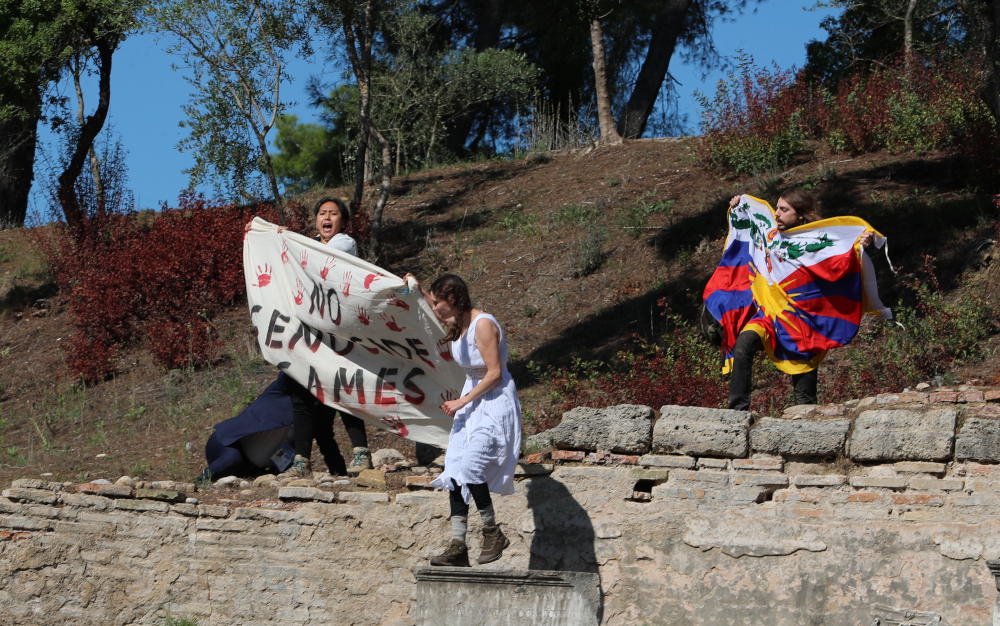 Protesters hold a Tibetan flag and a banner during the Olympic flame lighting ceremony for the Beijing 2022 Winter Olympics in Ancient Olympia, Greece October 18, 2021. u00e2u20acu201d Reuters pic