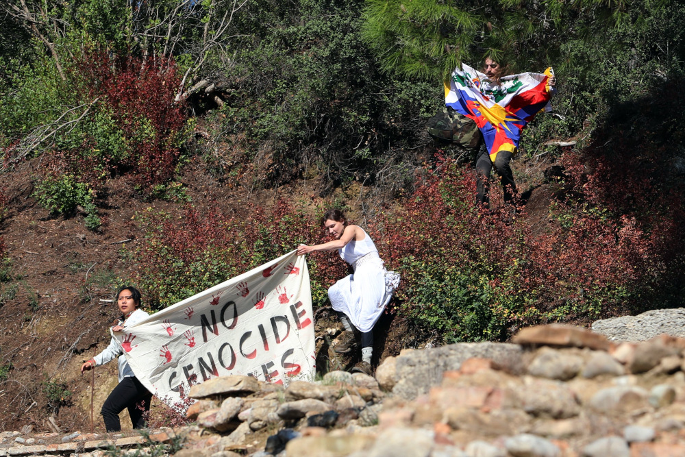 Protesters hold a Tibetan flag and a banner during the Olympic flame lighting ceremony for the Beijing 2022 Winter Olympics in Ancient Olympia, Greece October 18, 2021. u00e2u20acu201d Reuters pic