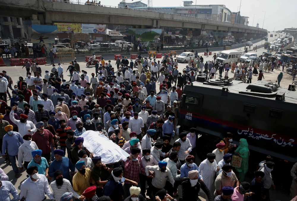 People carry the body of Supinder Kour, a school teacher who was shot and killed by suspected militants, during her funeral in Srinagar October 8, 2021. u00e2u20acu201d Reuters pic