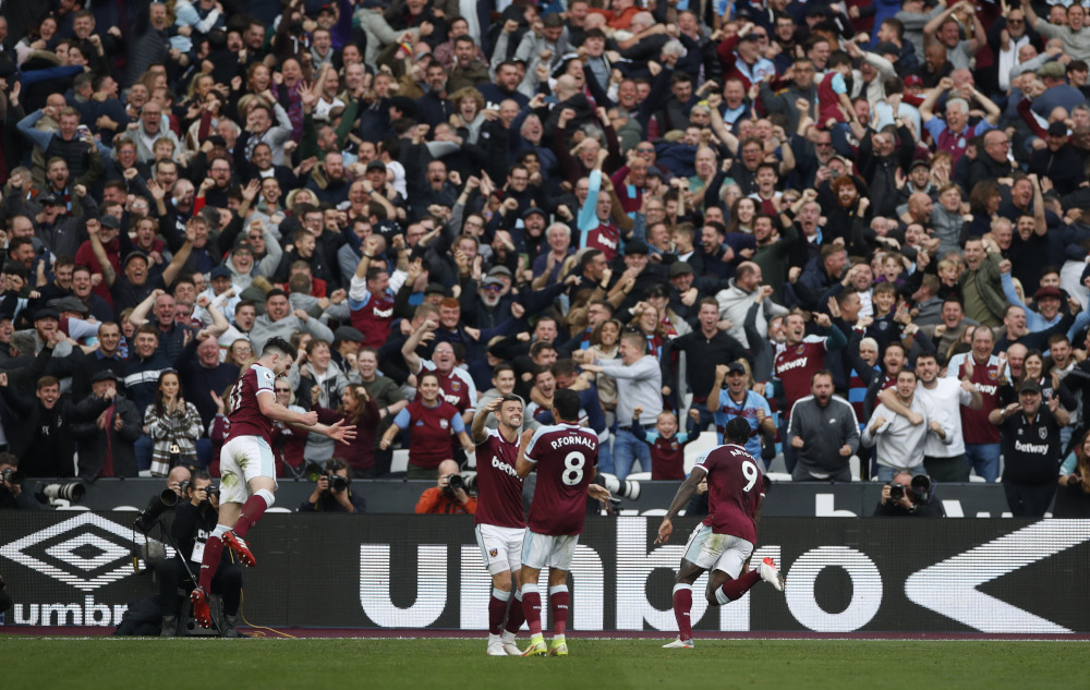West Ham Unitedu00e2u20acu2122s Michail Antonio celebrates scoring their first goal with teammates during their Premier League match against Tottenham Hotspur at the London Stadium, London October 24, 2021. u00e2u20acu201d Action Images/Paul Childs pic via Reuters  