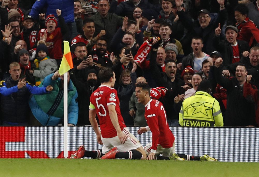 Manchester United's Cristiano Ronaldo celebrates scoring their third goal against Atalanta with Harry Maguire at Old Trafford, Manchester October 20, 2021. u00e2u20acu201d Reuters picnn