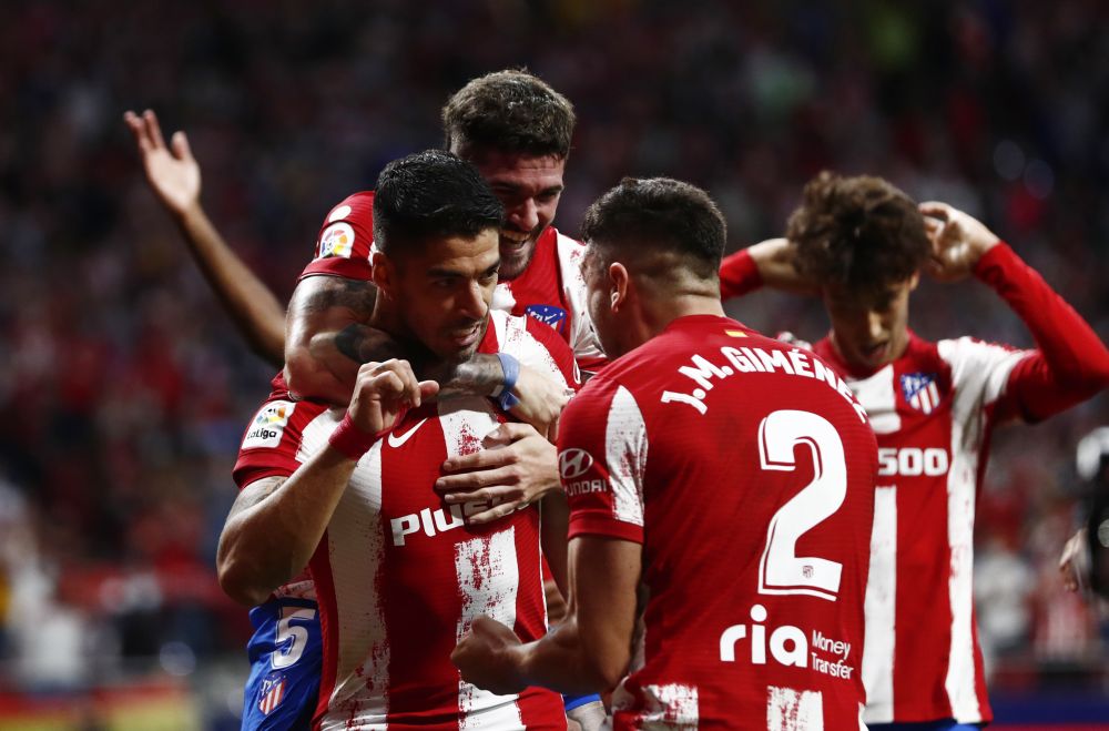 Atletico Madrid's Luis Suarez celebrates scoring their second goal against Barcelona with teammates at Wanda Metropolitano, Madrid  October 2, 2021.  u00e2u20acu201d Reuters picn n