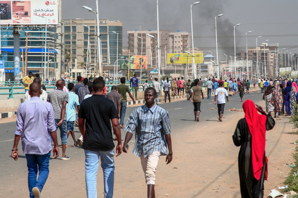 Sudanese demonstrators rally in the capital Khartoum, October 25, 2021, to denounce overnight detentions by the army of members of Sudanu00e2u20acu2122s government. u00e2u20acu201d AFP picn