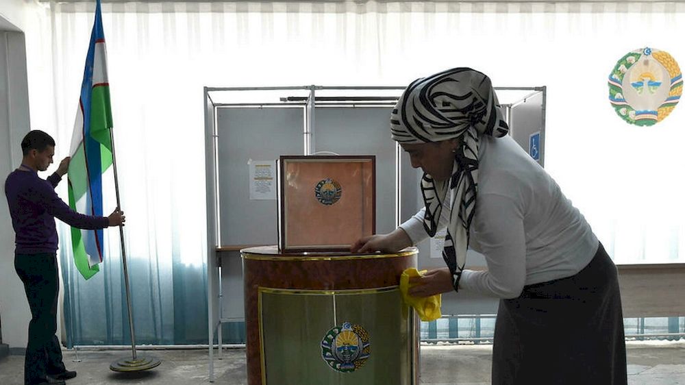 Local election commission members prepare a polling station for Sundayu00e2u20acu2122s presidential election in Tashkent. u00e2u20acu201d AFP pic