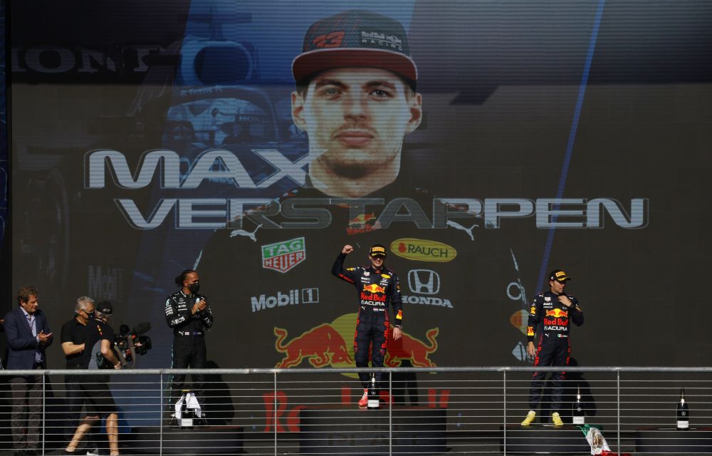 Red Bull's Max Verstappen celebrates on the podium after winning the US Grand Prix alongside second place Mercedes' Lewis Hamilton and third place Red Bull's Sergio Perez October 24, 2021. u00e2u20acu201d Reuters pic