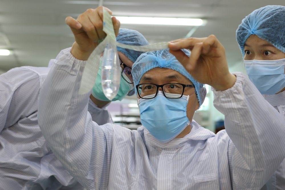 Founder and inventor of Wondaleaf Unisex Condom John Tang Ing Ching inspects the unisex condom at his factory in Sibu October 19, 2021. u00e2u20acu2022 Reuters pic