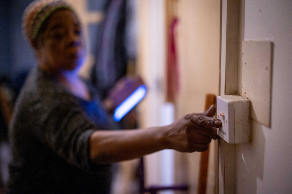 Doreen Thompson turns off her water heater as she limits her use of heating to keep up with her increasing energy bills, at her home in south London, on November 3, 2021. u00e2u20acu201d AFP pic