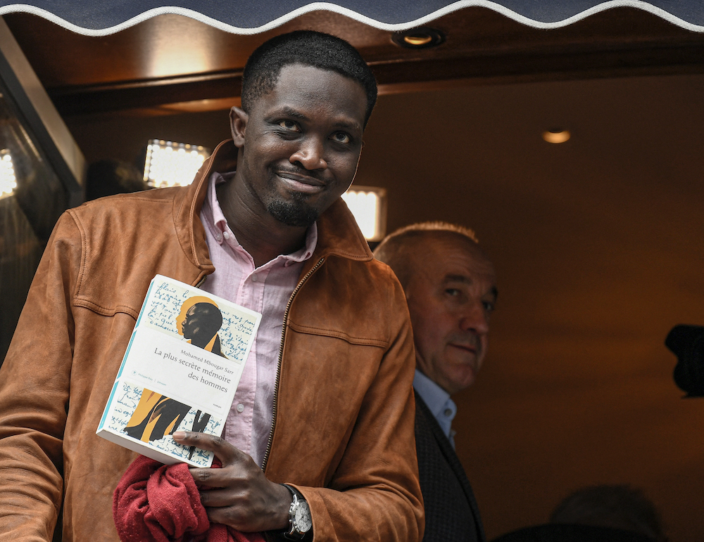Senegalese novelist Mohamed Mbougar Sarr poses for the press after being awarded with the Prix Goncourt literary prize for his novel u00e2u20acu02dcLa plus secrete memoire des hommesu00e2u20acu2122 (Mankind most secret memory), in Paris November 3, 2021. u00e2u20acu201d AFP pic