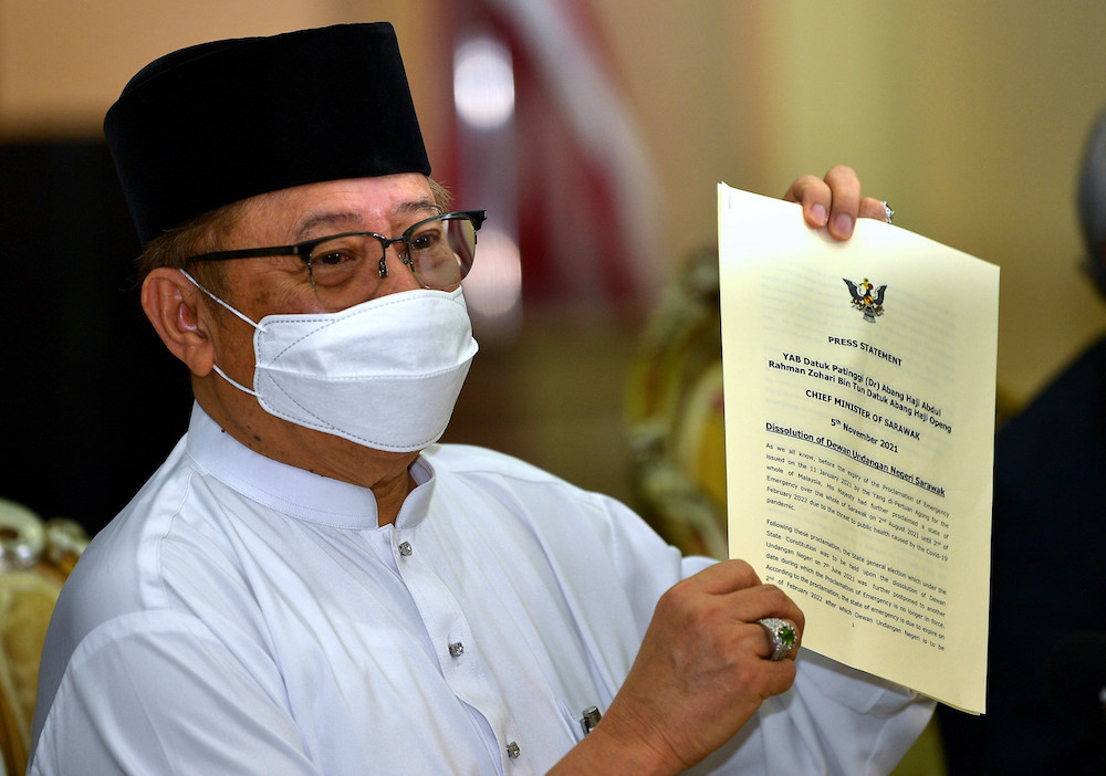 Chief Minister Datuk Patinggi Abang Johari Tun Openg shows reporters the press statement on the dissolution of the Sarawak State Assembly at a press conference in Petra Jaya November 5, 2021. u00e2u20acu201d Bernama pic