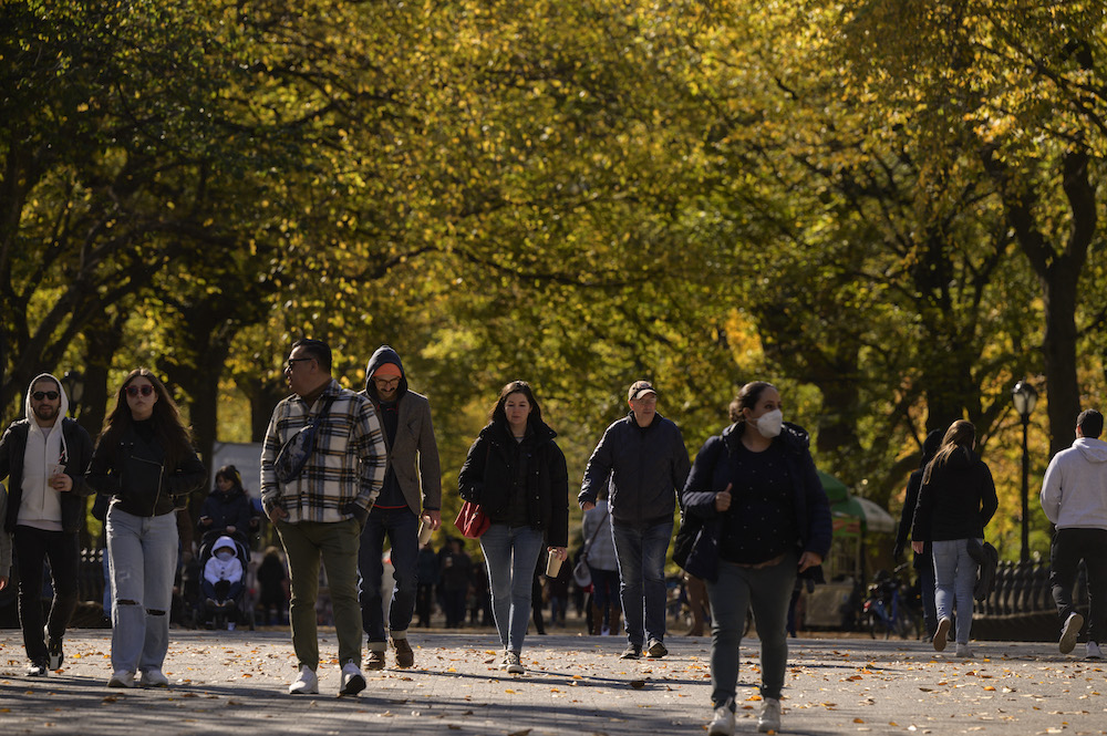 People walk beneath fall foliage in Central Park in New York on November 5, 2021. u00e2u20acu201d AFP pic