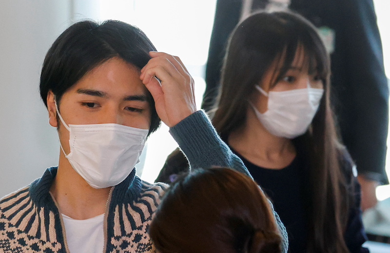 Mako Komuro, former Japan's Princess Mako, and her newly married husband Kei are checked in before they board a flight bound for New York to start their new life in the US at Haneda airport in Tokyo, Japan November 14, 2021. u00e2u20acu201d Reuters pic