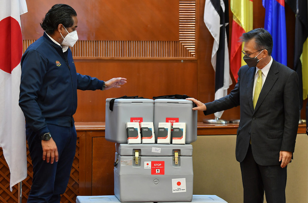 Health Minister Khairy Jamaluddin receives Japanu00e2u20acu2122s contribution of cold chain equipment from Japanese Ambassador to Malaysia Oka Hiroshi in Putrajaya November 15, 2021. u00e2u20acu201d Bernama pic