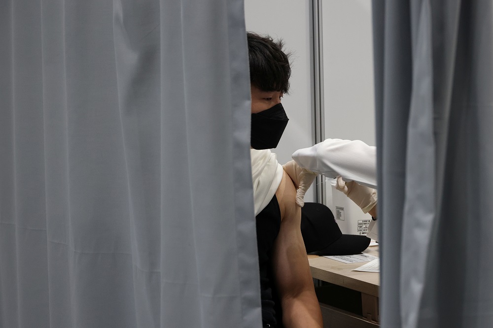 A man gets a dose of the Pfizer-BioNTech coronavirus disease vaccine at a Covid-19 vaccination centre on the last day of its operation in Seoul October 29, 2021. u00e2u20acu201d Reuters pic