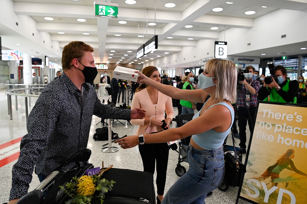 A couple is reunited at Sydney Airport in the wake of coronavirus disease border restrictions easing, November 1, 2021. u00e2u20acu201d Reuters pic