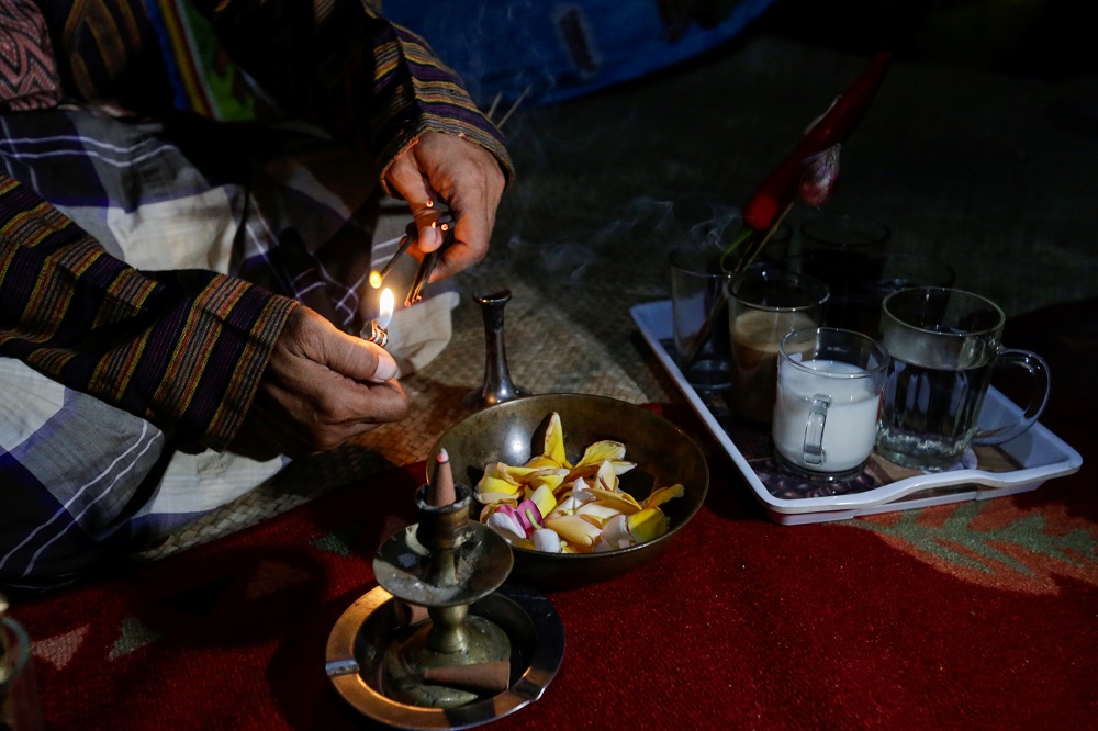 Ki Joko Sapu Jagat lights incense sticks for a ritual following the ease of restrictions amid the coronavirus disease pandemic as Indonesia’s traditional rain charmers get back in business in Bekasi October 16, 2021. — Reuters pic