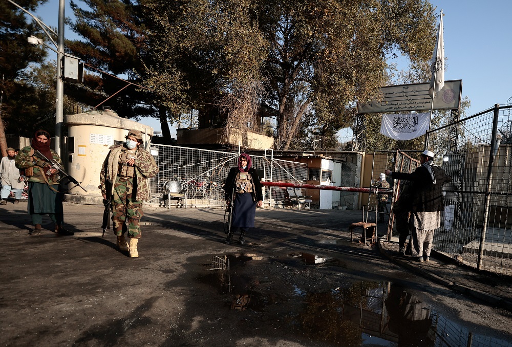 Taliban fighters stand guard as their comrade searches a man outside the military hospital after yesterday' blasts and gunfire in Kabul November 3, 2021. u00e2u20acu201d Reuters pic