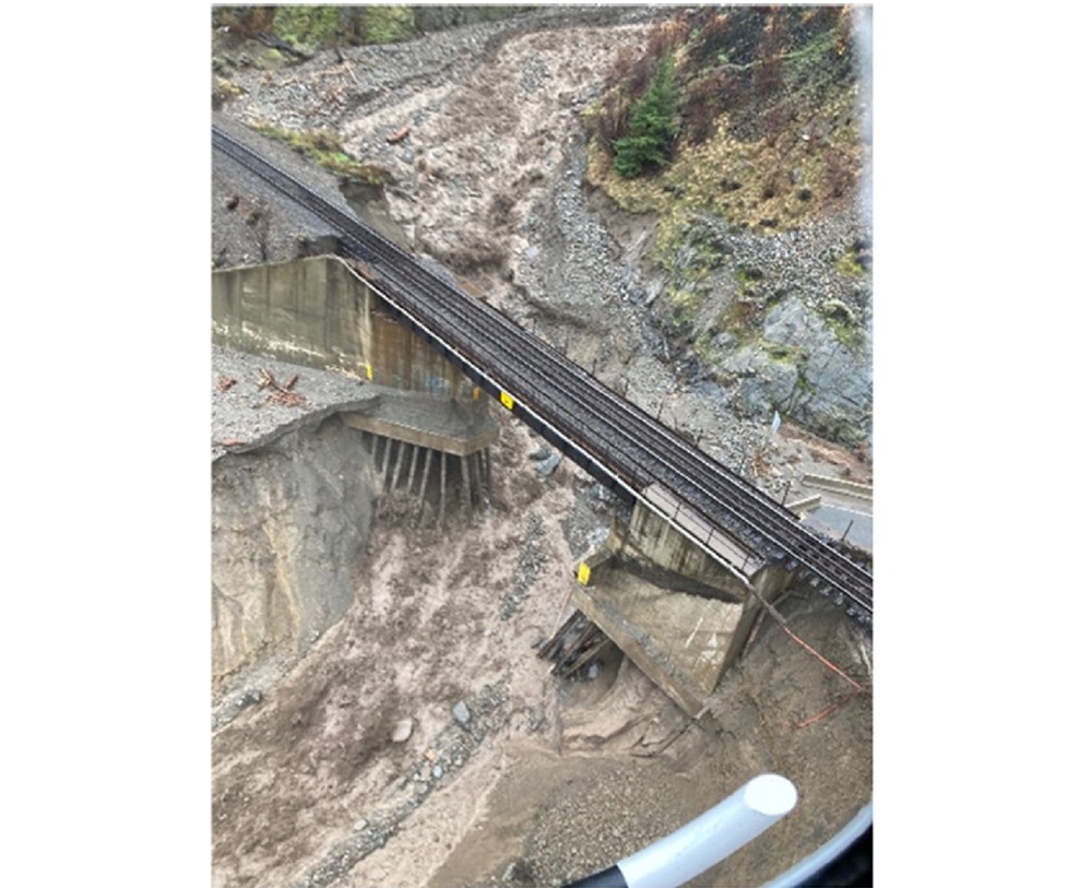 An aerial view shows a damaged road as a flood sweeps through, near Lytton, British Columbia November 15, 2021. u00e2u20acu201d Picture courtesy of BC Ministry of Transportation and Infrastructure/Handout via Reuters