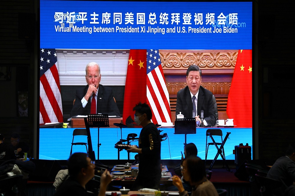 A screen shows Chinese President Xi Jinping attending a virtual meeting with US President Joe Biden via video link, at a restaurant in Beijing November 16, 2021. u00e2u20acu201d Reuters pic