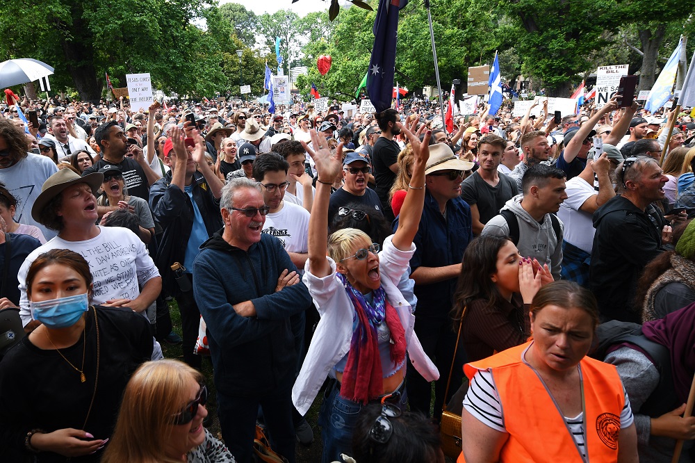 People participate in a u00e2u20acu02dcThe Worldwide Rally for Freedomu00e2u20acu2122 protest against mandatory vaccinations and lockdown measures in Melbourne November 20, 2021. u00e2u20acu201d AAP Image/James Ross via Reuters